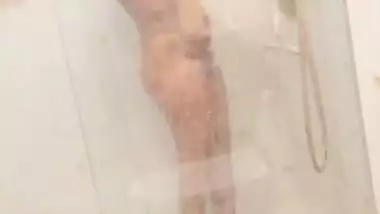 Desi girl under shower naked bath caught on camera